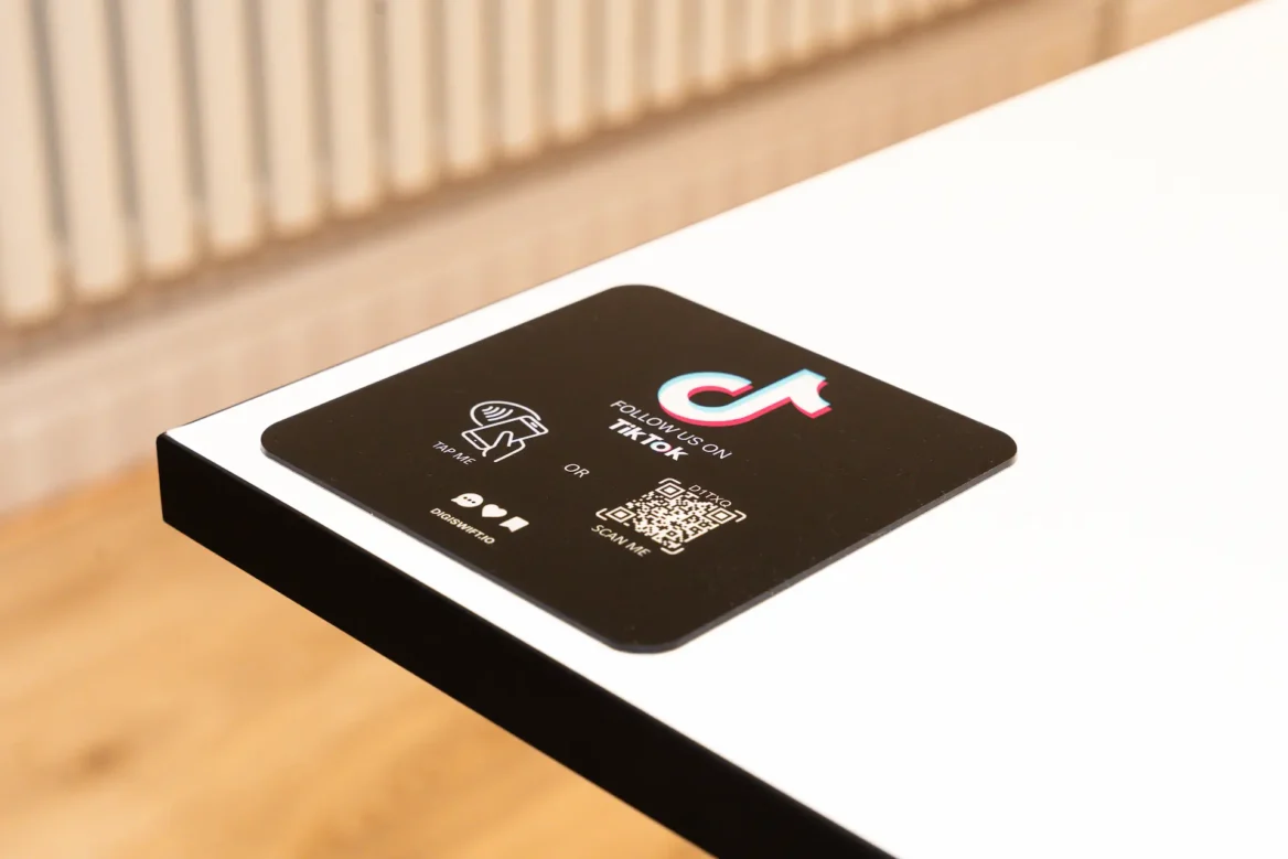 Black NFC TikTok Plaque on white table